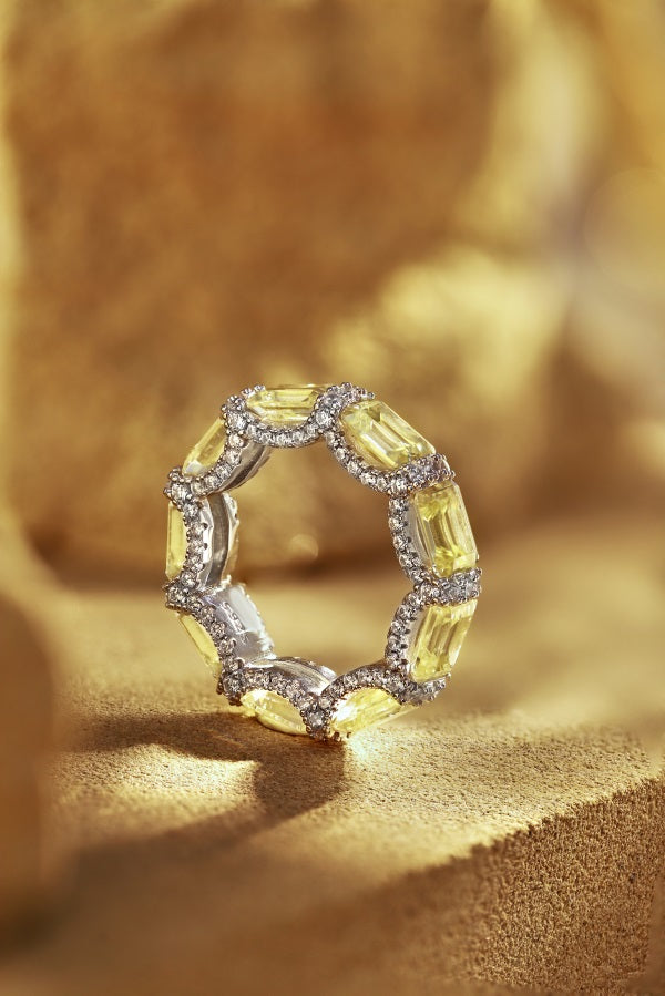 eternity ring, handcrafted in 925 sterling silver set with sparkling yellow cubic zirconia stones.