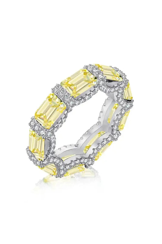 eternity ring, handcrafted in 925 sterling silver set with sparkling yellow cubic zirconia stones on a white background