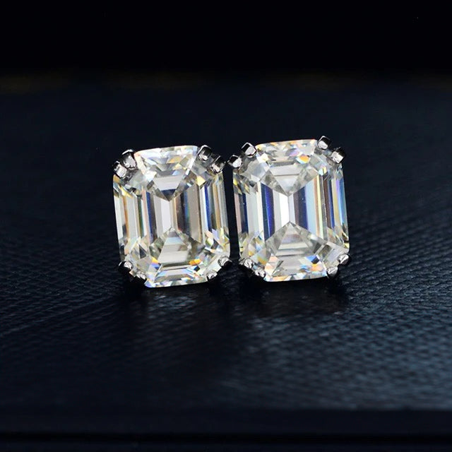 A pair of classic emerald-cut sparkling crystal solitaire stud earrings. Handcrafted in 925 sterling silver. Made by Lucky 13 Jewelry.