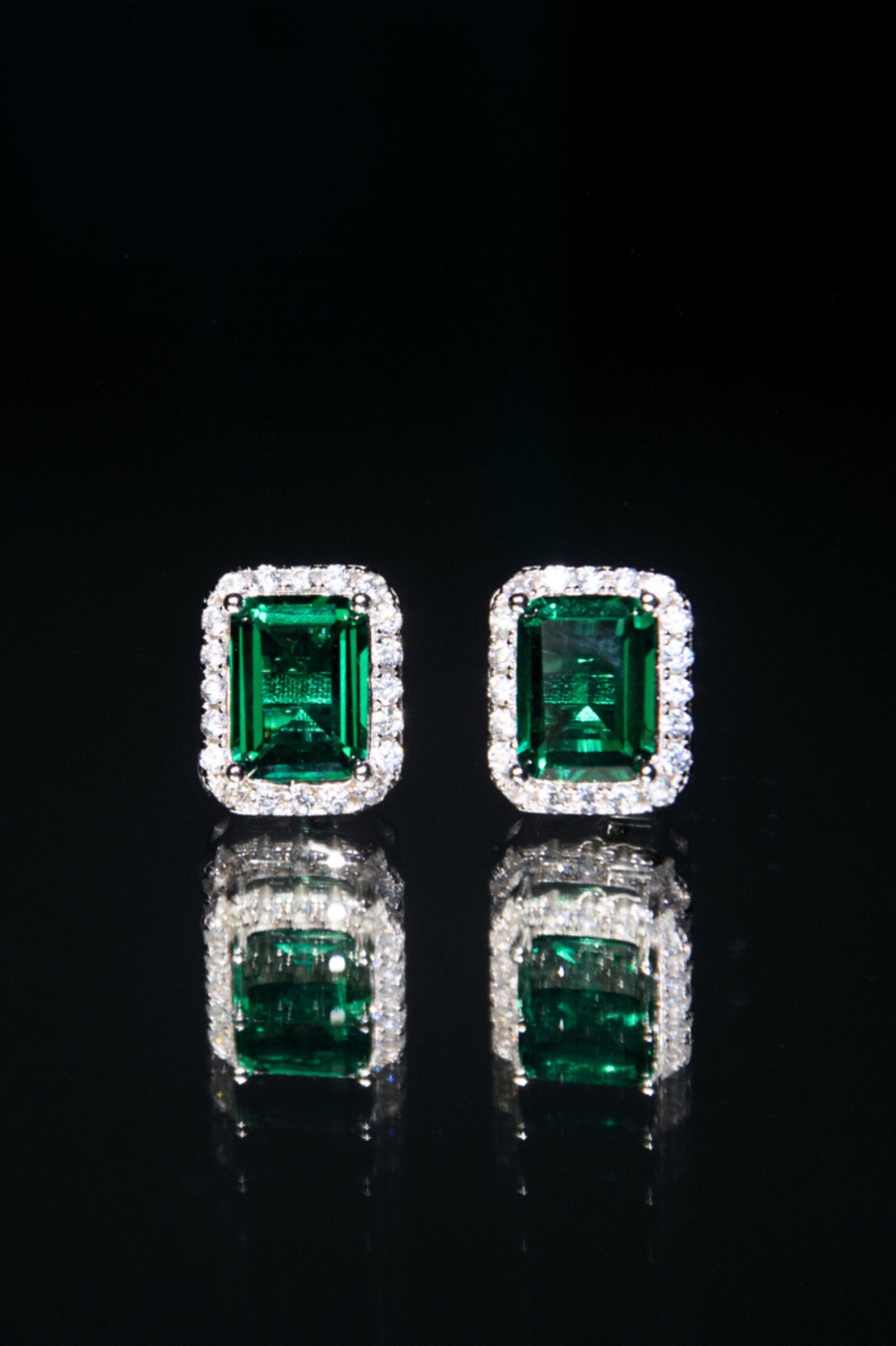 Lucky 13 Emerald stud earrings, emerald cut, 925 sterling silver, rhodium plated with green cubic zirconia.