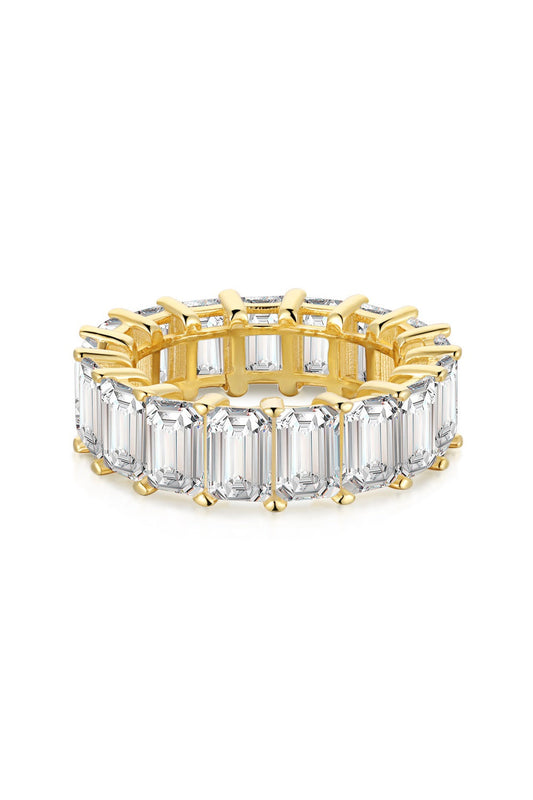 Elegant and timeless gold eternity ring band handcrafted in 925 sterling silver set with shining emerald rectangular cut cubic zirconia stones