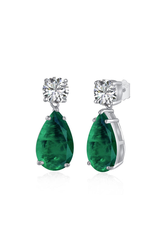 A pair of JADE EARRINGS by LUCKY13 for women featuring a large, pear-shaped green gemstone hanging from a smaller round, clear gemstone. The gemstones are set in 925 sterling silver with a claw setting, and the earrings have a post and butterfly back fastening.