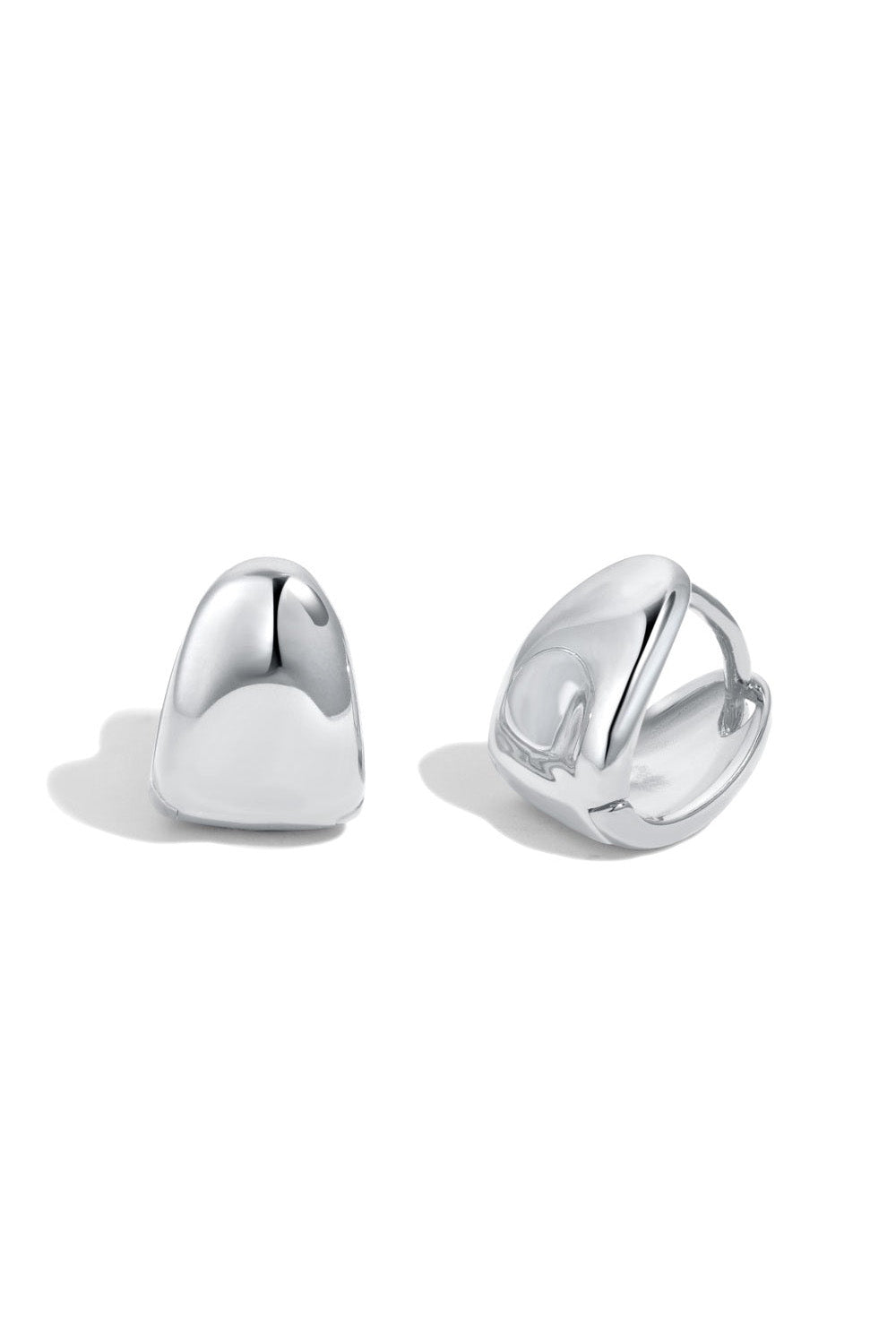 Introducing PUFFY HUGGIES by LUCKY13, a pair of meticulously handcrafted earrings made from polished 925 Sterling Silver with an optional 14K Gold plating. The left earring is displayed with the front facing forward, while the right earring is shown from a side angle, revealing the clip mechanism on the back.