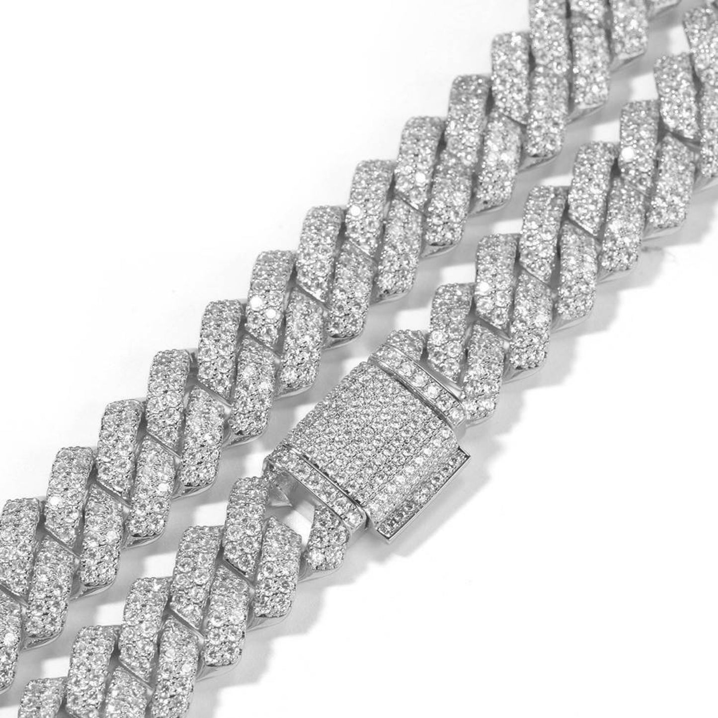 A close-up shot of a sparkling silver Cuban link chain encrusted with diamonds, featuring a rectangular box clasp also adorned with diamonds. The LUCKY13 CUBAN LINK BRACELET is shown laid out flat on a white background, embodying timeless elegance.